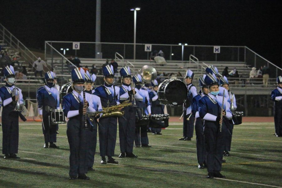 Champion High Schools Marching Band preforming on the Boerne ISD field during a football game in preparation for UIL competition.
