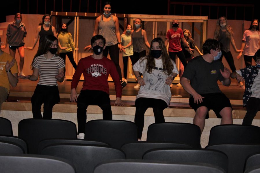 The cast of Grease practices for their big show coming up by running through dance scenes with the Champion Charms.