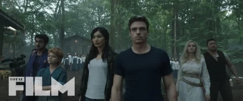 The Eternals arrive in the Amazon forest to reunite with Druig (Barry Keoghan), who has been living there since they parted ways in 1521 CE.

Characters left to right:
Kingo (Kumail Nanjiani), Sprite (Lia McHugh), Sersi (Gemma Chan), Ikaris (Richard Madden), Thena (Angelina Jolie), and Gilgamesh (Don Lee).