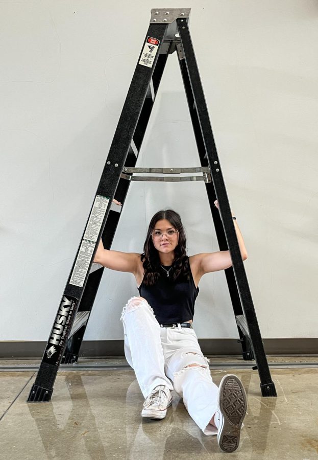 On Friday the 13th our Photo Editor, Carly Earnest, sits under a ladder in the main foyer, a Friday the 13th superstition. Avoid any superstitious activities.