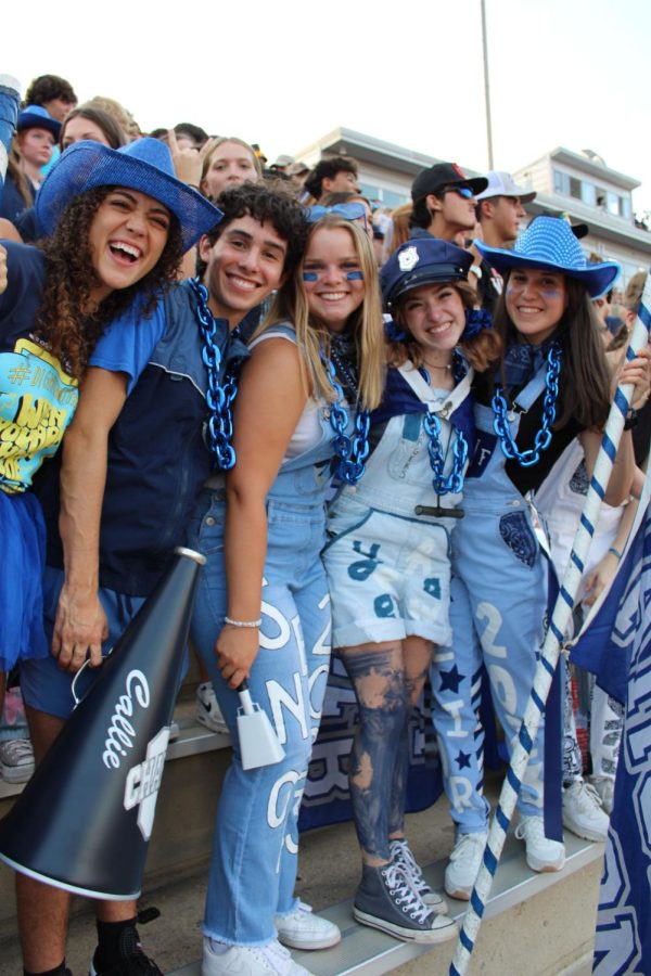 Student council seniors sport spirit wear in the student section during the first home football game of the season; Charger Stampedes main goal is to hype up spirit at sports games with high attendance, megaphones (like the one pictured), and overall excitement.