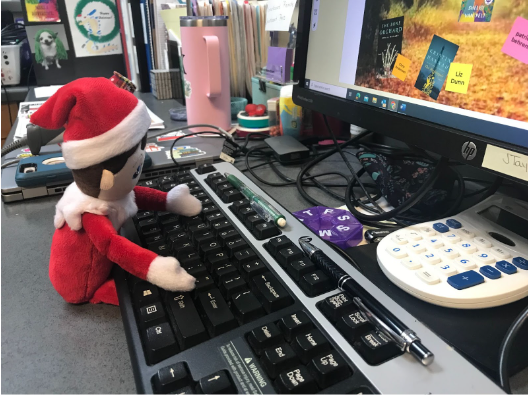 Sammy the elf causes some mischief at the front desk.