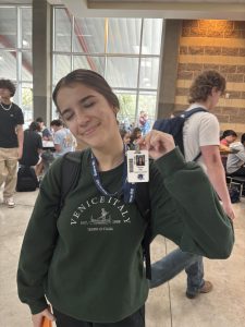 Photo credit: Madison Hernandez. Junior Naomi Ros poses with her ID.
