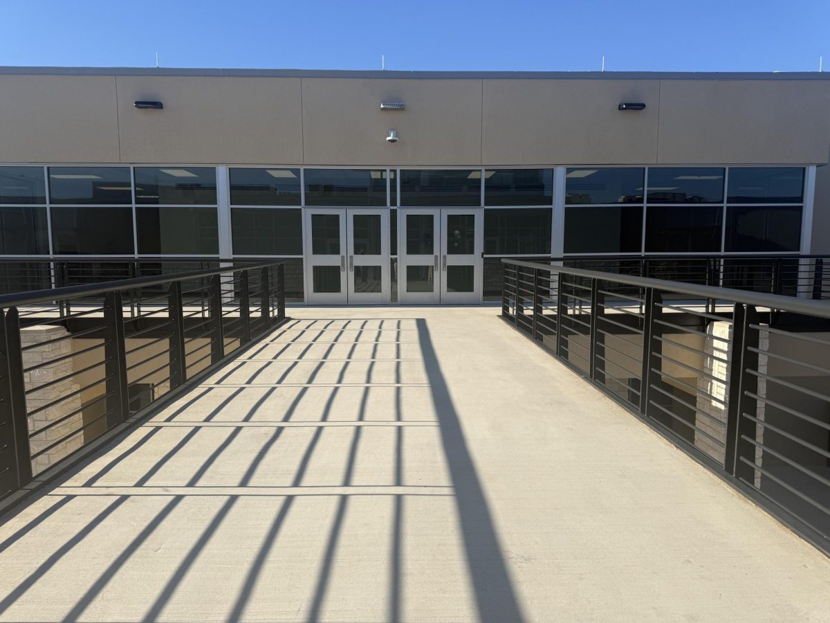 The bridge connecting the school to the new building.